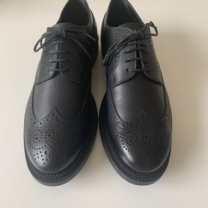 Tod’s black wingtip lace-ups